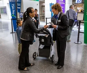 Airport Butler assisting airport passengers